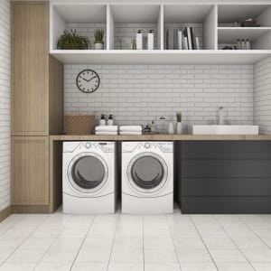 white tile flooring in laundry room with washer and dryer