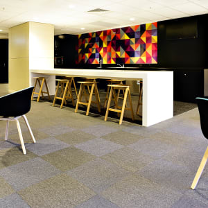 blue and gray checkered carpet tiles in a lounge